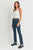 Woman wearing a white top and blue jeans on a white background